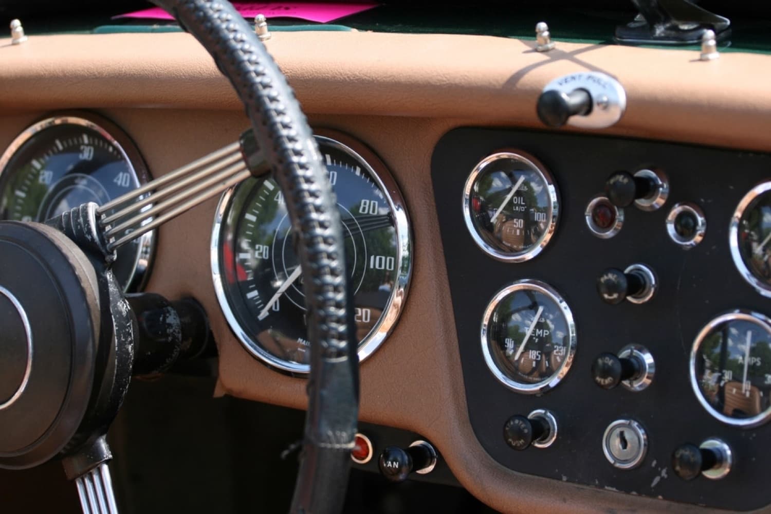 Ridgeline Auto Care — warm close-up of a classic car's gauges and wheel